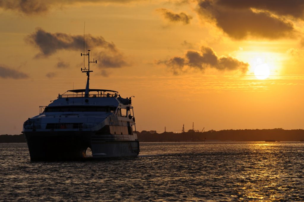 Combine a dramatic Balinese sunset with a sumptuous meal aboard a luxury sea-going vessel