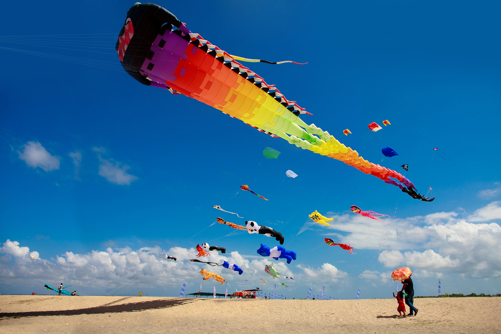 Witness hundreds of kites dancing in the sky above Sanur. 