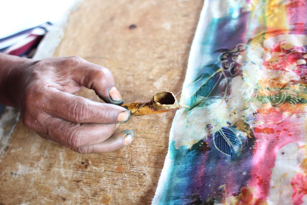 Batik painting in bali when it rains