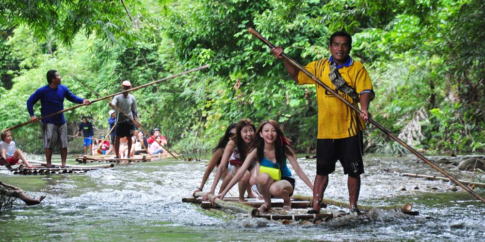Try your hand at bamboo rafting in beautiful Lam Ru National Park